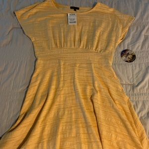 Never worn yellow short sleeve dress with tags.